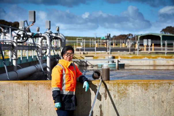 Water professional wearing high visibility safety jacket in foreground - Melton Recycled Water Plant