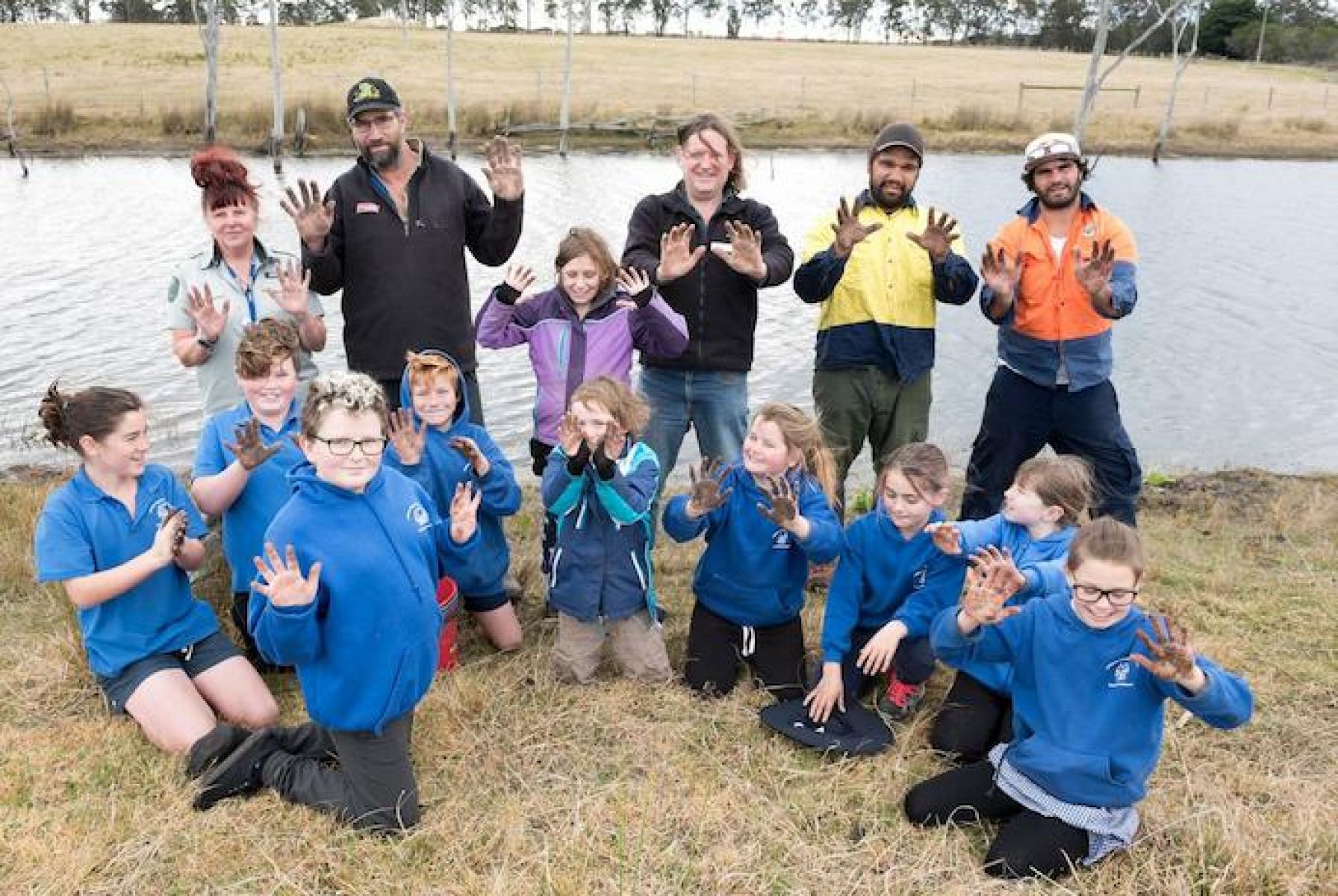 Photo of students from Lindenow Primary School, Gunaikurnai Land and Water Aboriginal Corporation and Greening Australia participating in tree planting.