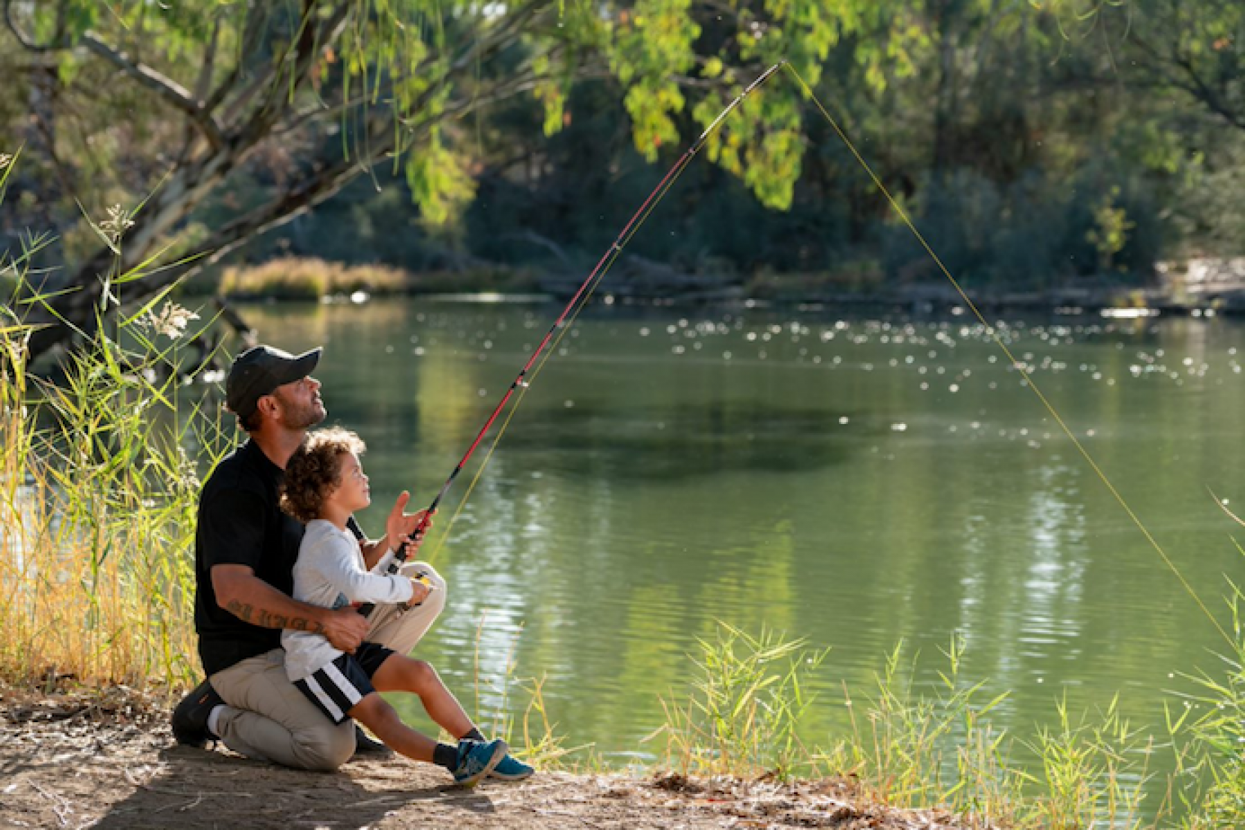 Picture of parent and child fishing.